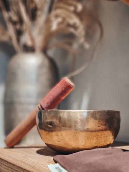 Singing bowl with wooden stick -